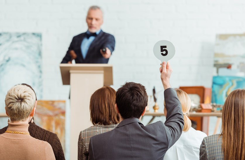 Man bidding at Live Auction